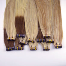Load image into Gallery viewer, Real Human Hair Blonde High light Two Tone #27/613 Tape in Hair Extensions شعر بشري حقيقي أشقر عالي الخفة بلونين # 27/613 شريط في وصلات الشعر